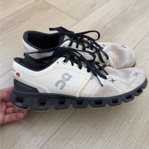 On Running Cream and Black Athletic Shoes with CloudTec Sole